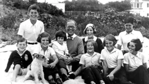 A photo of John F. Kennedy and his family in Hyannis Port. John F. Kennedy is wearing a white shirt in the upper left corner. (Wikimedia Commons)